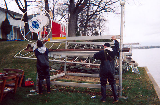 A boat lift being installed by an H.Y.O. Services expert team.