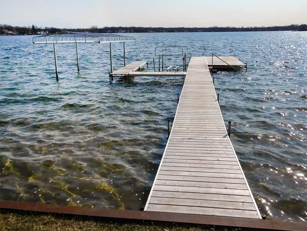 Seasonal dock with boat canopy and watercraft lift